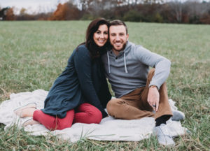 Photo of Josh and Christi Straub in a field