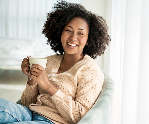 Young black woman with coffee cup