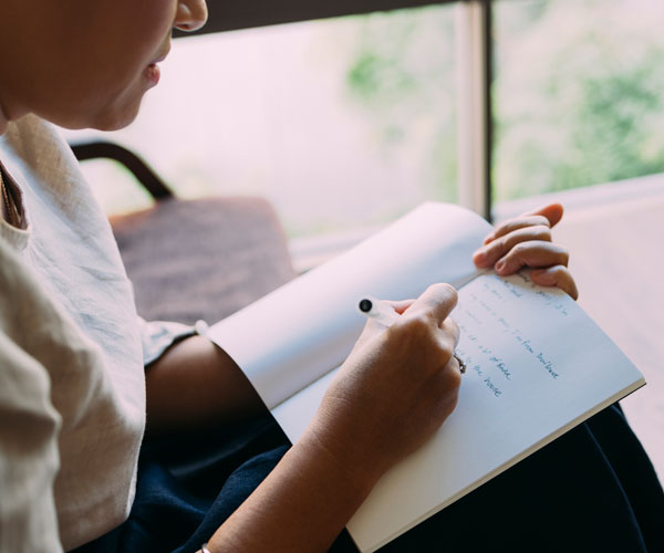 Woman using a journal