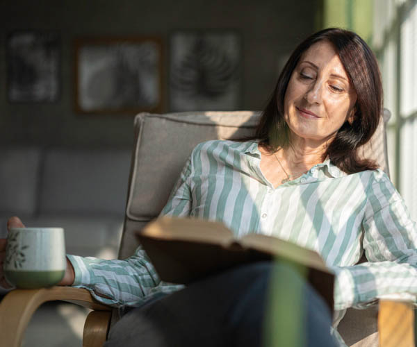 woman reading about the Lord of Armies in Scripture