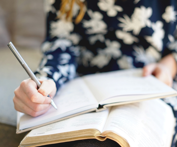 Woman studying the essentials of the faith